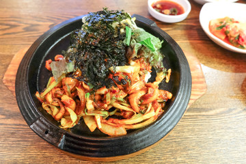 Jukkumi Bokkeum, Traditional Korean dish. This is vegetables with pork, squid and spicy sauce in hot pot.