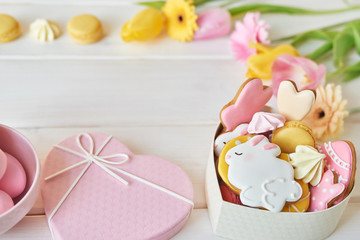 Easter greeting card with flowers, gingerbread cookies and eggs. Easter Postcard Template. Cookies in shape of eggs and Easter bunny. Happy Easter holiday background concept.