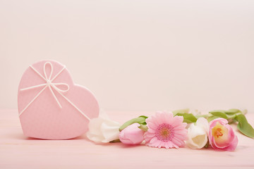 Valentine's day composition pink gift box with flowers. Valentine card. Greeting card template. Space for text. Concept of Happy Valentine's day. Mother's day card. Spring flowers on pink background