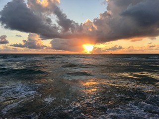 Fototapeta na wymiar Sunrise over the water of the Atlantic Ocean on South Beach, Miami Florida
