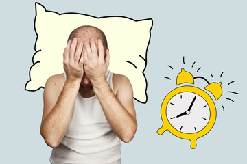 the man with a pillow in the morning reset the alarm and overslept late for work. now he sits, remembers and covers his face