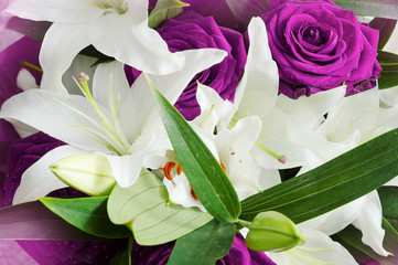 bouquet of purple roses and white lilies close-up