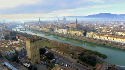 AERIAL. Panorama of the city of FLORENCE in Italy with the dome and Palazzo della Signoria and arno river
