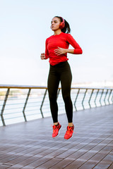 Young woman exercising outside © BGStock72
