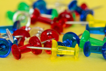 Colorful pile of drawing pins