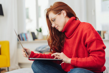 Young woman in a bright red winter sweater