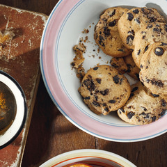 Homemade chocolate cookies cup tea wooden table top view
