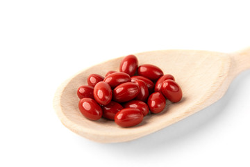 Brown pills isolated on white background.