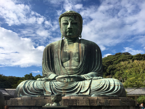 Big Buddha image: The famous statue of the Great Buddha, Daibutsu, among the many temples in Kamakura, Japan.