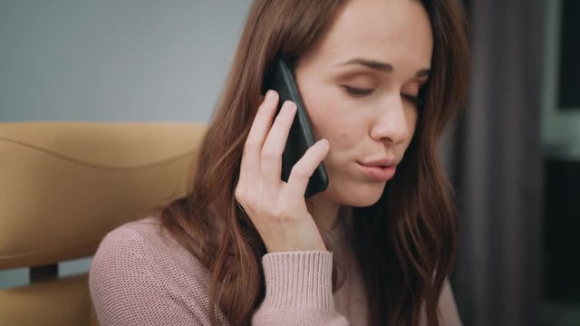 Beautiful woman face talking phone. Portrait of speaking woman with mobile