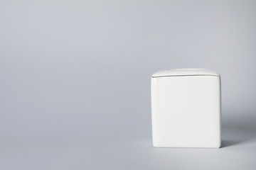 Empty napkin holder on gray background. Space for text