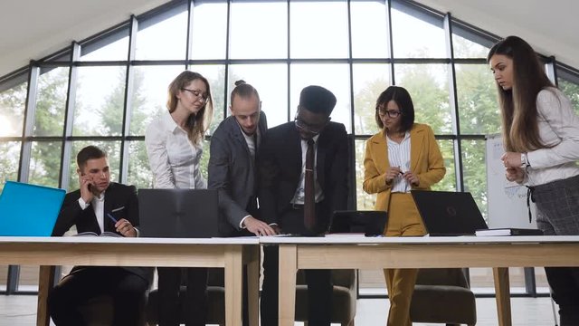 African american businessman presenting business offer for business partners at meeting in conference room, businessman influencing on clients decision with negotiation selling skill, convincing