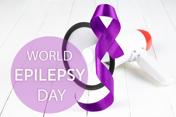 International or world Epilepsy Day concept. The text and a purple ribbon with megaphone on a white...