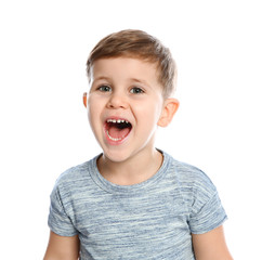 Portrait of little boy laughing on white background