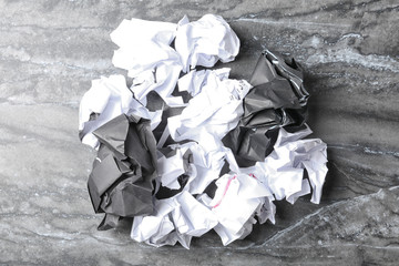 Pile of crumpled paper on grey background, top view. Recycling problem