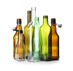 Empty glass bottles on white background. Recycling problem
