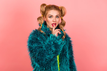 Minimal fashion Pop Art girl. Vanilla pastel pink colors. Girl in a fur coat