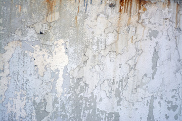 Old, rusty concrete wall with rust and cracks