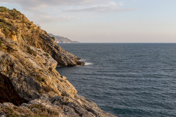 Fototapeta na wymiar Seascape with steep slopes and the sea