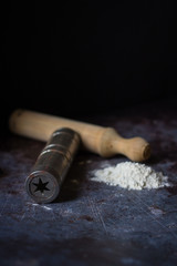 cooks keep rolling pin, wooden dining table, flour, dough