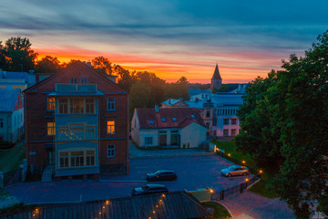 Summer sunset and beautiful sky above the historical part of Tartu, Estonia. Jaani kirik (St. John's Church) tower in the right. View from the Dome hill.