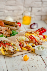 Assorted tortilla wraps with meat, sausages, cheese