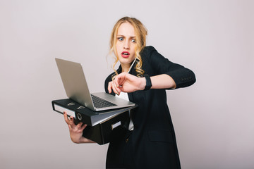 Work office busy time of blonde young woman in formal clothes with laptop, folder talking on phone on white background. Astonished, working, profession, secretary, office worker, manager