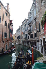Fototapeta na wymiar Views Of The Apostoli River And Beautiful Gondolas Moored From The Bridge In The CountrysideApostoli In Venice. Travel, holidays, architecture. March 28, 2015. Venice, Veneto region, Italy.