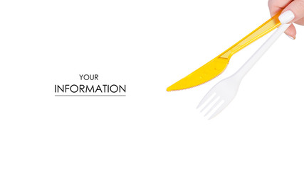 Plastic fork and knife in hand pattern on a white background isolation
