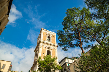 Fototapeta na wymiar Belltower of Santa Chiara Church in Naples City, Italy
