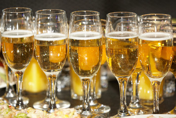 Glasses with champagne or wine of gold color