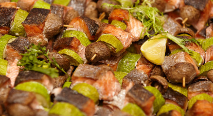grilled vegetables and salmon with greens and lemon