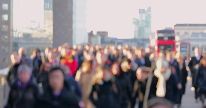 Defocused Shot Of Commuters Walking To Work Over London Bridge UK In Slow Motion