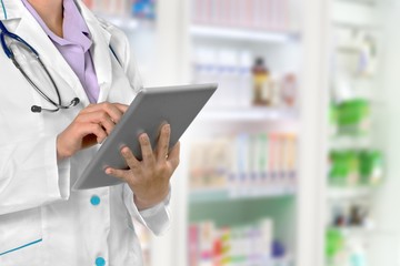 Close-up Doctor at hospital working with tablet pc