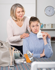 Mature woman supporting her daughter