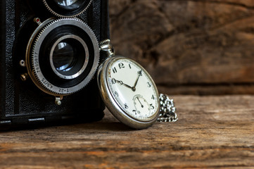1970 s ancient, old pocket watch and chain, vintage locket watch on chestnut rustic wooden...