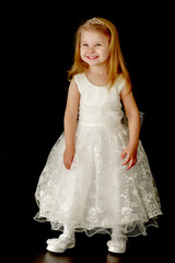 Fototapeta premium Little girl on a black background