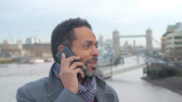 African businessman takes a phone call in London
