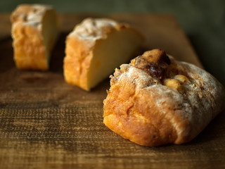 Ciabatta. homemade italian ciabatta bread top view. Bread with cheese. Sliced fresh bread on a wooden tray.