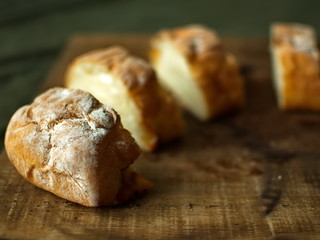 Ciabatta. homemade italian ciabatta bread top view. Bread with cheese. Sliced fresh bread on a wooden tray.