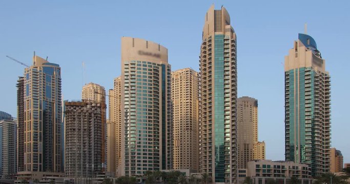 View on Dubai Marina modern Towers from night to day. Time Lapse.