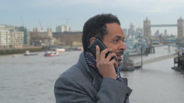 African businessman takes a phone call in London