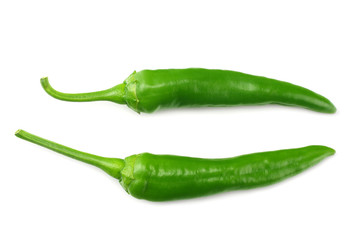 green hot chili peppers isolated on white background top view
