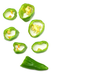 sliced green hot chili peppers isolated on white background top view