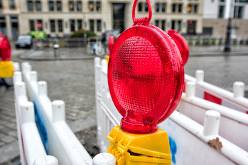 red warning light of temporary road fence