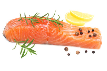 Red fish. Raw salmon fillet with rosemary and lemon isolate on white background.