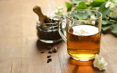 Green tea with jasmine blossom,  copy space