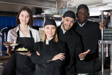 Team of restaurant staff in kitchen