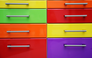 multi-colored boxes with metal accessories close - up-background, texture.