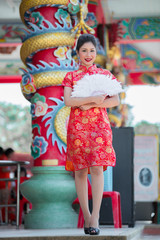 Obraz na płótnie Canvas Portrait of beautiful asian woman in Cheongsam dress,Thailand people,Happy Chinese new year concept